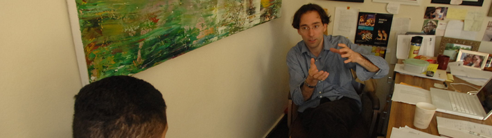 Dr. Mark Yakich advises student in his office